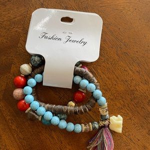 Stackable bracelets with cute little elephants and living trees.
